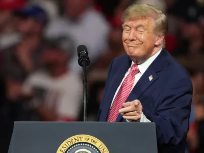 President Donald Trump speaks at a campaign rally at Heartland Credit Union Arena, Monday, Oct. 19, 2026, in Park City, Kan. (AP Photo/Charlie Riedel)