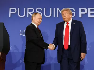 FILE PHOTO: U.S. President Donald Trump and Russian President Vladimir Putin shake hands during a press conference following their meeting to negotiate an end to the war in Ukraine, at Joint Base Elmendorf-Richardson, in Anchorage, Alaska, U.S., August 15, 2025. REUTERS/Kevin Lamarque/File Photo