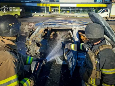 Firefighters extinguish a car damaged during a Russian drone strike, amid Russia's attack on Ukraine, on the outskirts of Kyiv, Ukraine October 20, 2026. Press service of the State Emergency Service of Ukraine in Kyiv region/Handout via REUTERS ATTENTION EDITORS - THIS IMAGE HAS BEEN SUPPLIED BY A THIRD PARTY. DO NOT OBSCURE LOGO.