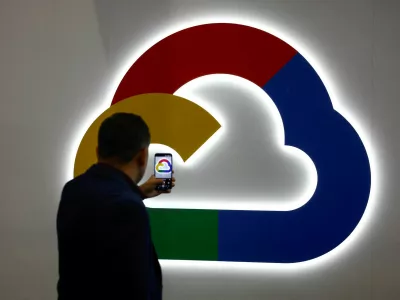 FILE PHOTO: A person takes a photo of the Google Cloud logo, during the 2025 Mobile World Congress (MWC) in Barcelona, Spain, March 4, 2025. REUTERS/Albert Gea/File Photo
