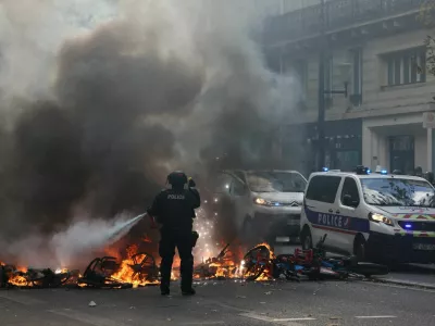 FILE PHOTO: A French police officer extinguish burning bicycles during a demonstration against the cost of living and rising fuel prices in Paris as part of nationwide protests called by the "Yellow Vests" movement, joined by French high school and university students, teachers and parents demanding better school conditions and government action, as well as labour unions, workers, farmers and retirees, France, October 17, 2026.  REUTERS/Jack Taylor/File Photo
