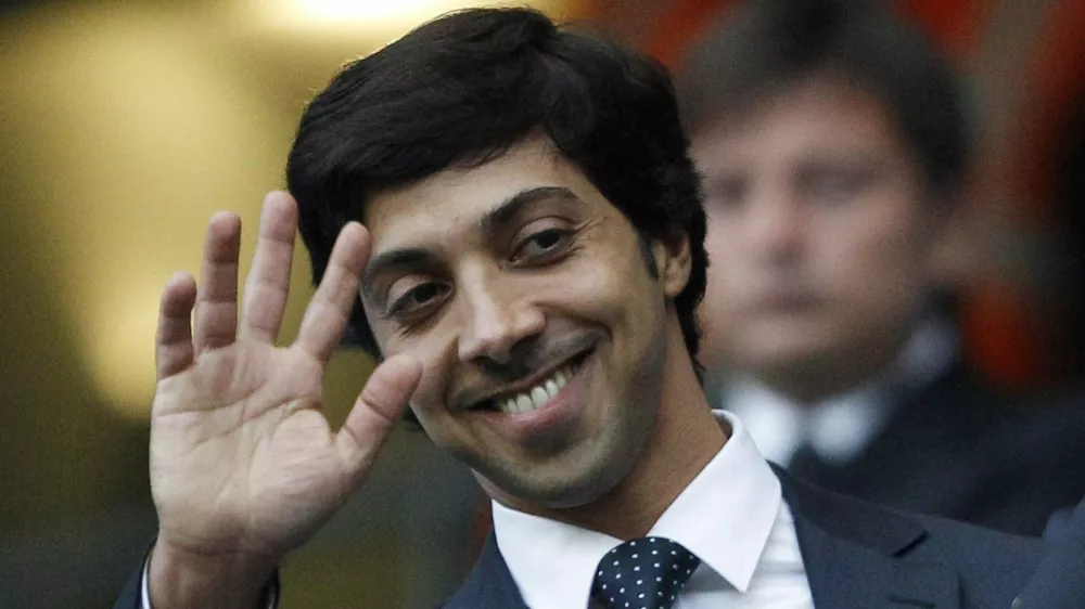 Manchester City's owner Sheik Mansour bin Zayed Al Nahyan waves ahead of their English Premier League soccer match against Liverpool at the City of Manchester stadium in Manchester, in this August 23, 2010 file picture. Clubs supported by benefactors sometimes end up paying more for players than total club turnover. Manchester City spent 107 percent of revenue on wages last season. To end lavish spending, UEFA has devised new regulations to force clubs to pay out no more than they earn. The new rules, which UEFA calls Financial Fair Play (FFP), begin August 2011 with the start of the European season. Clubs will have two years to begin balancing their books. If they don't meet FFP targets from the 2013/14 season, UEFA says it will expel them from club soccer's premier Champions League competition. That would lose a club tens of millions of euros in television revenue plus the global exposure that helps generate millions more in merchandise sales.  To match Special Report SOCCER-FAIRPLAY/   REUTERS/Darren Staples/Files  (BRITAIN - Tags: SPORT SOCCER BUSINESS) NO ONLINE/INTERNET USAGE WITHOUT A LICENCE FROM THE FOOTBALL DATA CO LTD. FOR LICENCE ENQUIRIES PLEASE TELEPHONE ++44 (0) 207 864 9000