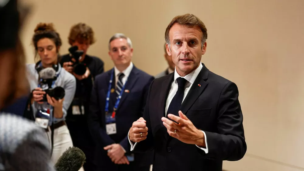 French President Emmanuel Macron speaks to members of the media on the day of the 9th Annual One Planet Sovereign Wealth Funds (OPSWF) Summit, in Lusail, Qatar, October 21, 2026. REUTERS/Benoit Tessier/Pool