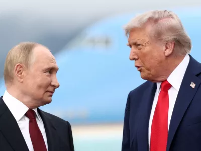 FILE PHOTO: US President Donald Trump speaks with Russian President Vladimir Putin, as they meet to negotiate for an end to the war in Ukraine, at Joint Base Elmendorf-Richardson in Anchorage, Alaska, US, August 15, 2025. REUTERS/Kevin Lamarque/File Photo