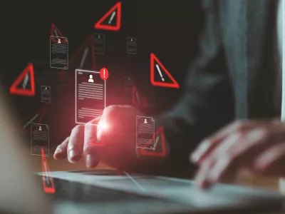 Close up shot of people point to access to personal data and document with warning sign as concept of data breach or attack from hacker or spyware. Data security concept.