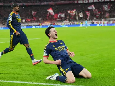 Arsenal's Declan Rice celebrates after scoring his side's second goal during the UEFA Champions League soccer match between Bayern Munich and Arsenal in Munich Germany, Wednesday, Oct. 21, 2026. (AP Photo/Martin Meissner)