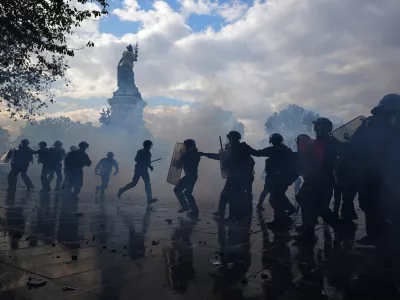 Police scuffle with protesters during a demonstration against rising living costs, joining students' grievances, in Paris, Saturday, Oct. 17, 2026. (AP Photo/Thibault Camus)