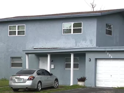 This undated image taken from video provided by WPLG-TV Thursday, Oct. 22, 2026, shows a home in Lauderhill, Fla., which a police officer is accused of illegally trying to take possession of after finding its' owner dead during a welfare check. (WPLG-TV via AP)