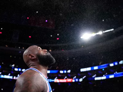 Philadelphia 76ers' LeBron James tosses chalk into the air before an NBA basketball game against the Cleveland Cavaliers Thursday, Oct. 22, 2026, in Philadelphia. (AP Photo/Matt Slocum)