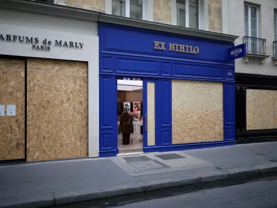 FILE PHOTO: View of shops with display windows protected by wooden panels days after nationwide protests against the cost of living and rising fuel prices in Paris, France, October 21, 2026. REUTERS/Stephane Mahe/File Photo
