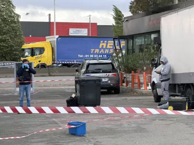 French police work at the scene after a drive-by shooting that killed one person and injured several others in Trappes, in the Yvelines department, near Paris, France, October 23, 2026. REUTERS/Antony Paone