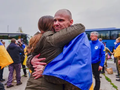 A Ukrainian soldier is welcomed after returning from captivity after a Prisoners of War (POWs) exchange between Russia and Ukraine, at an undisclosed location, Ukraine, Friday, Oct. 23, 2026. (AP Photo/Maria Yurkian)