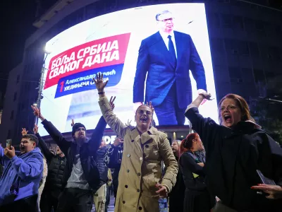 Youngsters cheer after polls closed in the parliamentary election in Belgrade, Serbia, Sunday, Oct. 25, 2026. (AP Photo/Marko Drobnjakovic)