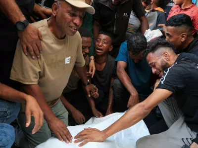 Mourners react during the funeral of three Palestinians who were killed in an Israeli strike, according to medics, at Al-Shifa Hospital in Gaza City, October 25, 2026. REUTERS/Dawoud Abu Alkas