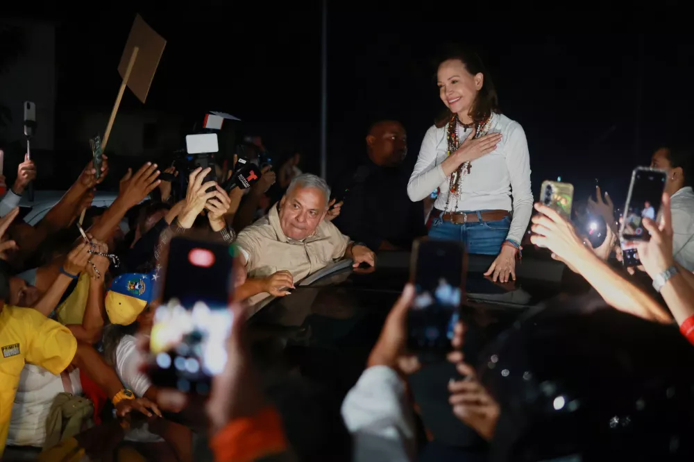 Venezuelan opposition leader and Nobel Peace Prize laureate Maria Corina Machado arrives in Caracas following her return to the country after months abroad, Sunday, Oct. 25, 2026.(AP Photo/Javier Campos)