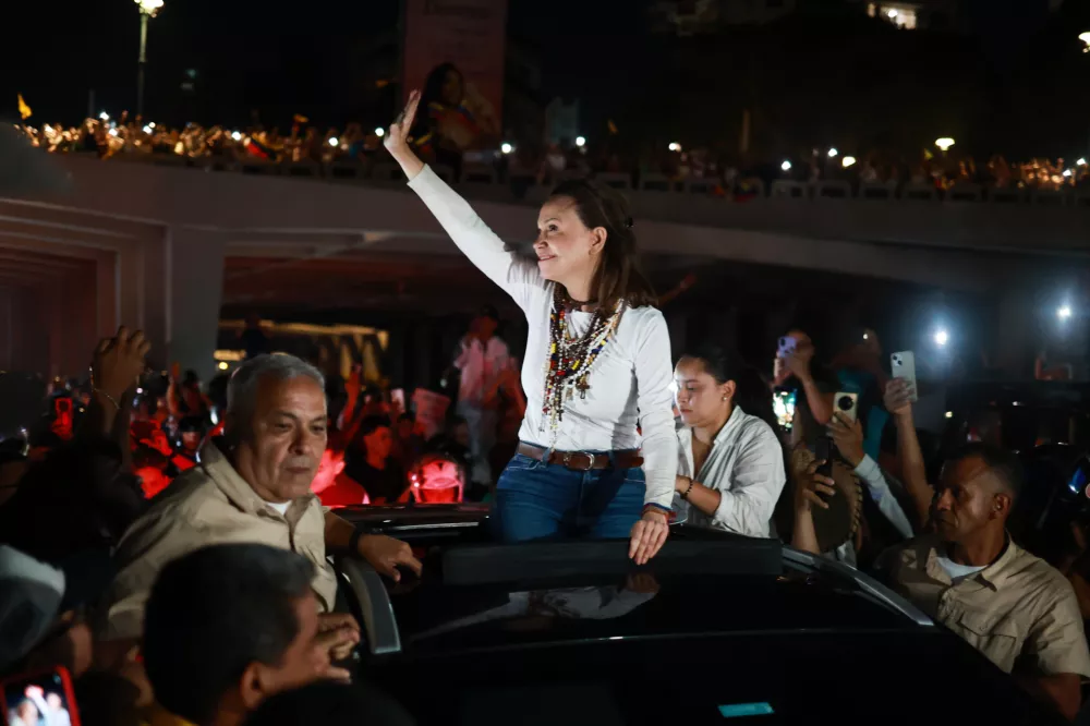 Venezuelan opposition leader and Nobel Peace Prize laureate Maria Corina Machado arrives in Caracas following her return to the country after months abroad, Sunday, Oct. 25, 2026.(AP Photo/Javier Campos)