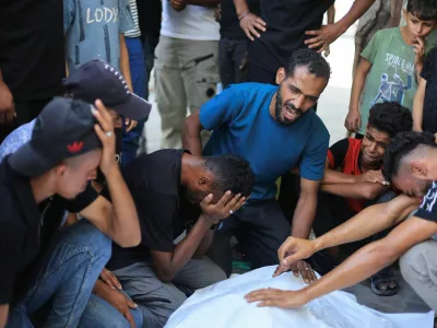 Mourners react during the funeral of three Palestinians who were killed in an Israeli strike, according to medics, at Al-Shifa Hospital in Gaza City, October 25, 2026. REUTERS/Dawoud Abu Alkas