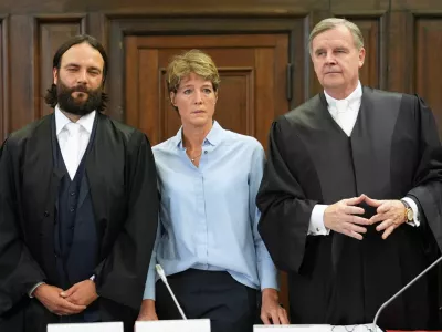 German entrepreneur and gastronome Christina Block and her lawyers Otmar Kury and Ingo Bott wait for the start of her trial at the regional court in Hamburg, Germany, July 11, 2025. Marcus Brandt/Pool via REUTERS