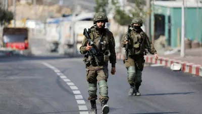 Israeli soldiers operate during a military operation in Hebron in the Israeli-occupied West Bank, October 25, 2026. REUTERS/Mussa Qawasma