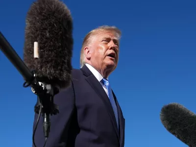 President Donald Trump talks to reporters before boarding Air Force One, at Joint Base Andrews, Md., Monday, Oct. 26, 2026, en route to a campaign rally in Mississippi. (AP Photo/Jacquelyn Martin)