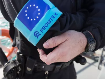 FILED - 01 March 2016, Greece, Vathi: A police officer of the EU border protection agency Frontex stands on the foredeck of a patrol boat in the port of the island of Samos. The&nbsp;European Union's second-highest court has dismissed a case brought by a Syrian family asking for damages against the bloc's border agency Frontex over alleged human rights abuses. Photo: Christian Charisius/dpa