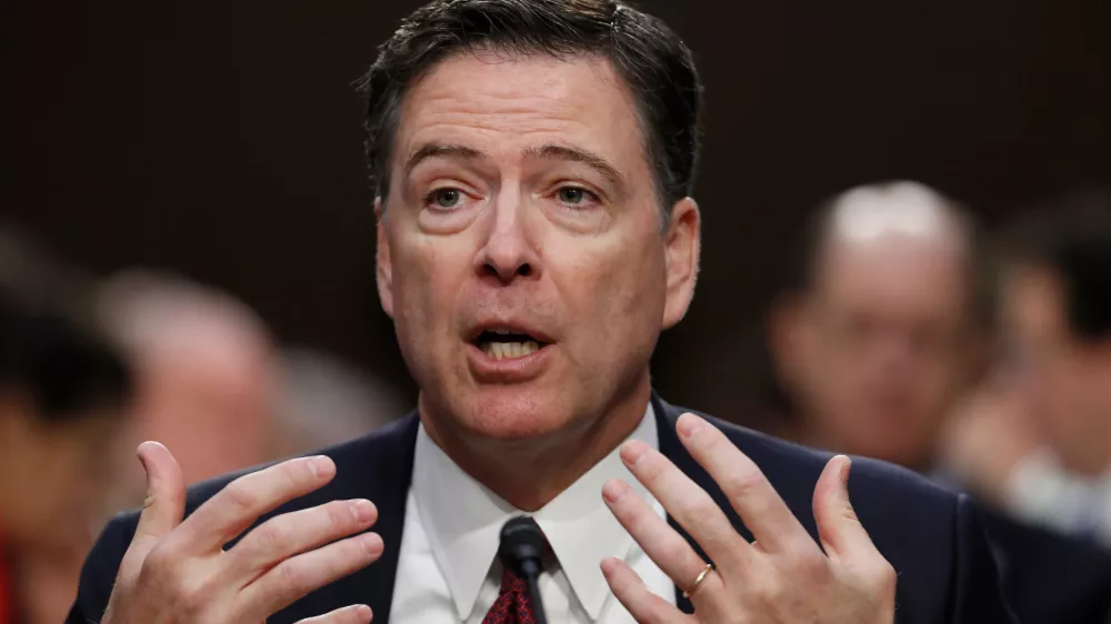 FILE - Former FBI Director James Comey speaks during a Senate Intelligence Committee hearing on Capitol Hill, Thursday, June 8, 2017, in Washington. (AP Photo/Alex Brandon, File)