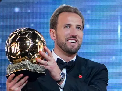 England's soccer player Harry Kane holds the player of the year trophy during the Ballon d'Or ceremony at the London Palladium Theatre in London, England, Monday, Oct. 26, 2026. (AP Photo/Kin Cheung)