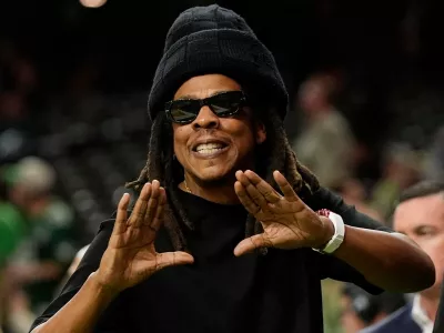 FILE - Jay-Z gestures from the sidelines prior to the NFL Super Bowl 59 football game, Feb. 9, 2025, in New Orleans. (AP Photo/Frank Franklin II, File)