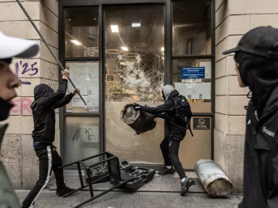 MILAN, ITALY - OCTOBER 18: Protesters vandalize a shop during protests in Milan, Italy, on October 18, 2026. Groups threw stones, bottles, firecrackers and barriers at police officers, who responded with tear gas and water cannon, while shops were damaged and looted around the city center and a Carabinieri vehicle was destroyed. Andrea Carrubba / AnadoluNo Use USA No use UK No use Canada No use France No use Japan No use Italy No use Australia No use Spain No use Belgium No use Korea No use South Africa No use Hong Kong No use New Zealand No use Turkey