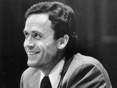 FILE - Ted Bundy smiles during the second day of jury selection for his murder trial in a Dade County courtroom in Miami, June 27, 1979. (AP Photo, Pool, File)