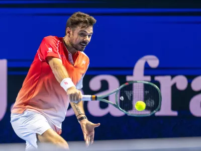 Switzerland's Stan Wawrinka returns a shot to Czech Republic's Jiri Lehecka during the first round of the Swiss Indoors tennis tournament in Basel, Switzerland, Tuesday, Oct. 27, 2026. (Georgios Kefalas/Keystone via AP)