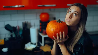 Pensive party host trying to prepare something traditional for Thanksgiving