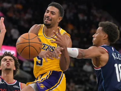 Oct 28, 2026; Inglewood, California, USA; Los Angeles Lakers guard Quentin Grimes (5) is fouled by Los Angeles Clippers forward Baba Miller (18) in the second half at Intuit Dome. Mandatory Credit: Jayne Kamin-Oncea-Imagn Images