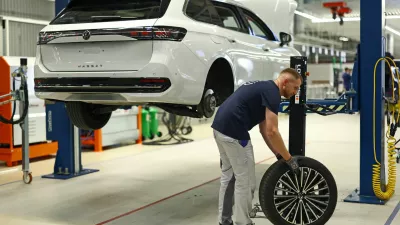 An employee of Volkswagen removes a dismantled wheel from a car at the group's first Circular Economy facility, at Volkswagen's EV factory in Zwickau, Germany, October 28, 2026. REUTERS/Lisi Niesner