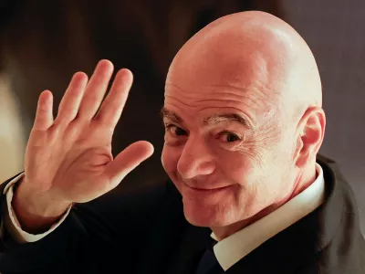 FILE PHOTO: FIFA president Gianni Infantino waves to reporters as he leaves from a venue for the Asian Football Confederation (AFC)'s extraordinary congress in Tokyo, Japan, October 23, 2026. REUTERS/Kim Kyung-Hoon/File Photo