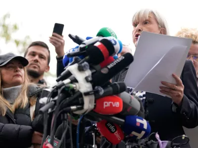 Mirjana Nikolic, right, rector of the University of Arts, speaks during a news conference by Serbia's student movement demanding the resignations of top police and security officials in Belgrade, Serbia, Thursday, Oct. 29, 2026. (AP Photo/Darko Vojinovic)