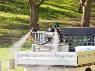 Machine for spraying mosquitoes in outdoor, note shallow depth of fields
