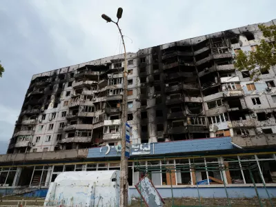 A residential building damaged from Russian attacks is seen during a local ceasefire related to a humanitarian aid mission in Oleshky, in Kherson, Ukraine, Thursday, Oct. 29, 2026. (AP Photo/Evgeniy Maloletka)