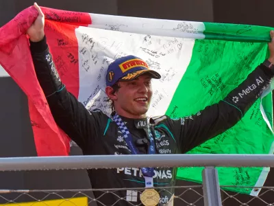 FILE - Mercedes driver Andrea Kimi Antonelli, of Italy, celebrates on the podium after winning the Italian Formula One Grand Prix race in Monza, Italy, Sept. 6, 2026. (AP Photo/Luca Bruno, File)