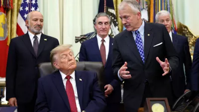 FILE PHOTO: US Senator Dan Sullivan (R-AK) speaks about an energy infrastructure project in Alaska as US President Donald Trump listens in the Oval Office at the White House in Washington, D.C., US, September 30, 2026. REUTERS/Kevin Lamarque/File Photo
