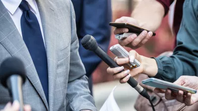 Media Interview - journalists with microphones interviewing formal dressed politician or businessman.