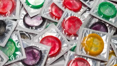 Colorful condoms background. Top view.