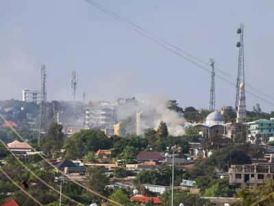 Smoke rises during fighting between Oromia and Somali regional states in a disputed region in southern Ethiopia, seen from the border town of Moyale, Kenya, Friday, Oct. 30, 2026. (AP Photo/Andrew Kasuku)