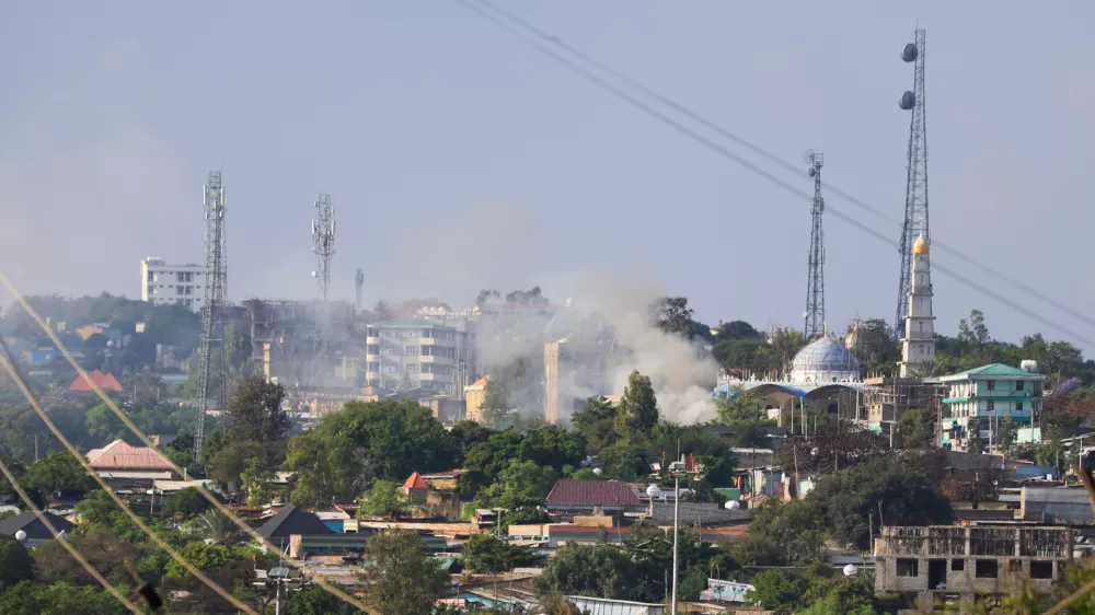 Smoke rises during fighting between Oromia and Somali regional states in a disputed region in southern Ethiopia, seen from the border town of Moyale, Kenya, Friday, Oct. 30, 2026. (AP Photo/Andrew Kasuku)