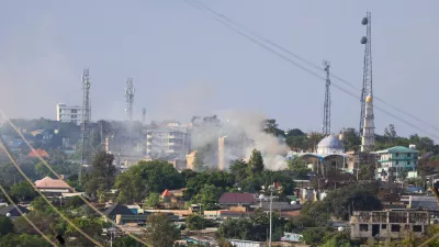 Smoke rises during fighting between Oromia and Somali regional states in a disputed region in southern Ethiopia, seen from the border town of Moyale, Kenya, Friday, Oct. 30, 2026. (AP Photo/Andrew Kasuku)