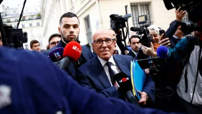 Eric Ciotti, head of the French conservative party Les Republicains (The Republicans - LR), is surrounded by journalists as he leaves the LR party headquarters in Paris, as French political parties try to build alliances ahead of early legislative elections in France, June 11, 2024. REUTERS/Sarah Meyssonnier