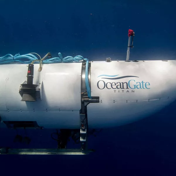 FILE PHOTO: The Titan submersible, operated by OceanGate Expeditions to explore the wreckage of the sunken SS Titanic off the coast of Newfoundland, dives in an undated photograph. OceanGate Expeditions/Handout via REUTERS NO RESALES. NO ARCHIVES. THIS IMAGE HAS BEEN SUPPLIED BY A THIRD PARTY./File Photo