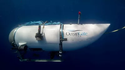 FILE PHOTO: The Titan submersible, operated by OceanGate Expeditions to explore the wreckage of the sunken SS Titanic off the coast of Newfoundland, dives in an undated photograph. OceanGate Expeditions/Handout via REUTERS NO RESALES. NO ARCHIVES. THIS IMAGE HAS BEEN SUPPLIED BY A THIRD PARTY./File Photo