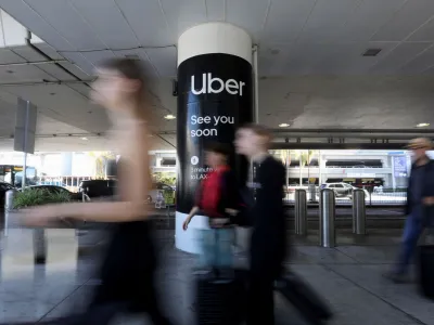 Uber ride-share signage is posted at Los Angeles International Airport (LAX) in Los Angeles, California, U.S. July 10, 2022. REUTERS/David Swanson