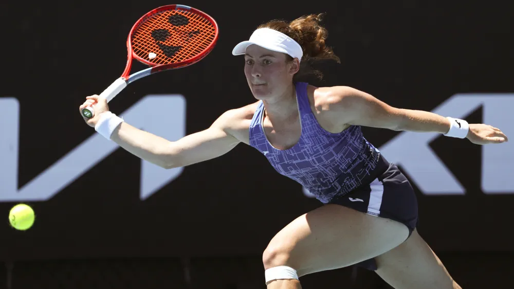 Tamara Zidansek of Slovenia plays a forehand return to Heather Watson of Britain during their second round match at the Australian Open tennis championships in Melbourne, Australia, Thursday, Jan. 20, 2022. (AP Photo/Tertius Pickard)